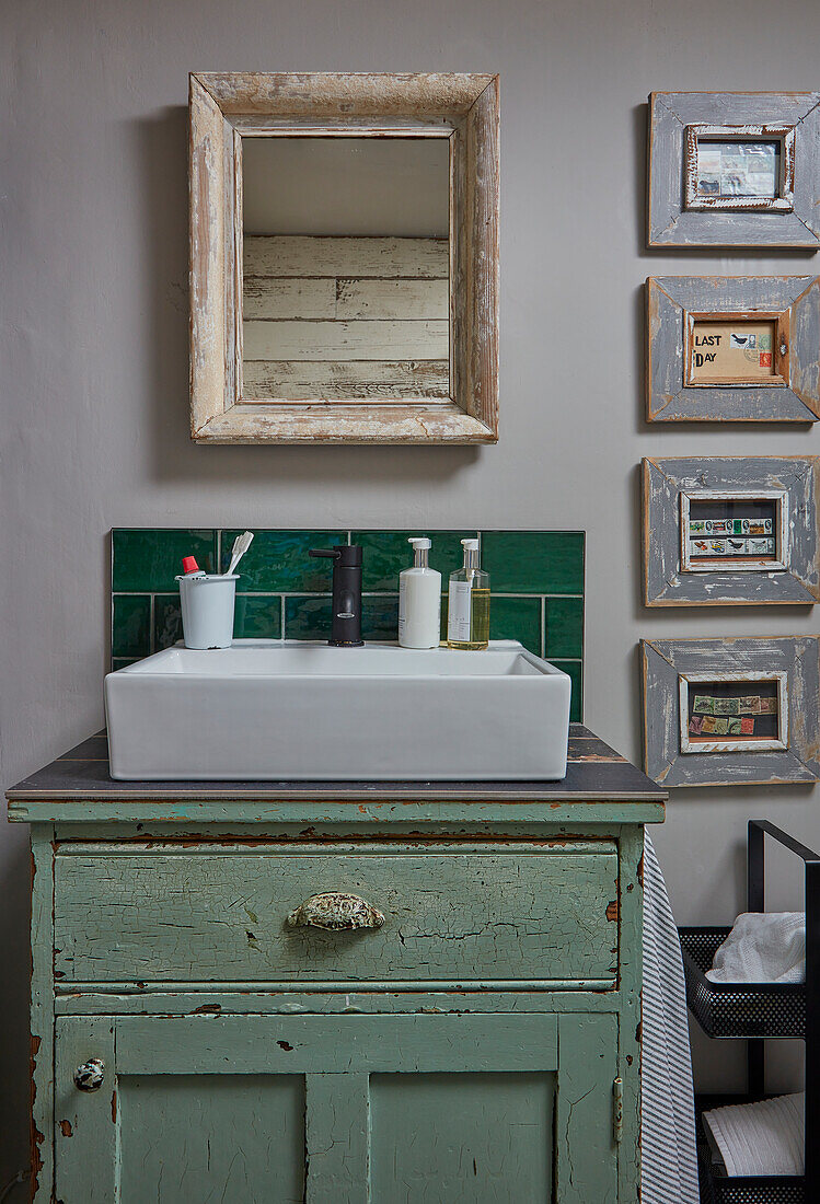 Vintage cupboard used as washstand in bathroom