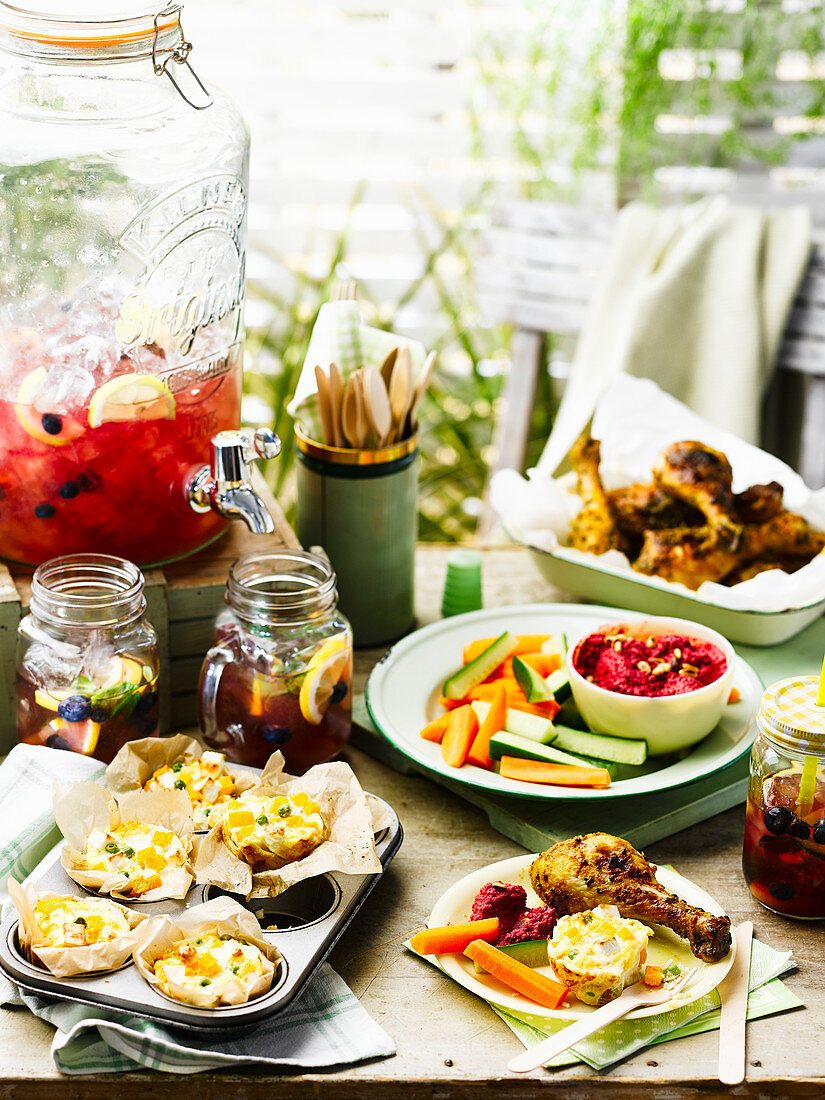 Squash and feta frittatinis, Beetrot houmous, Coronation drumsticks and Blueberry iced tea