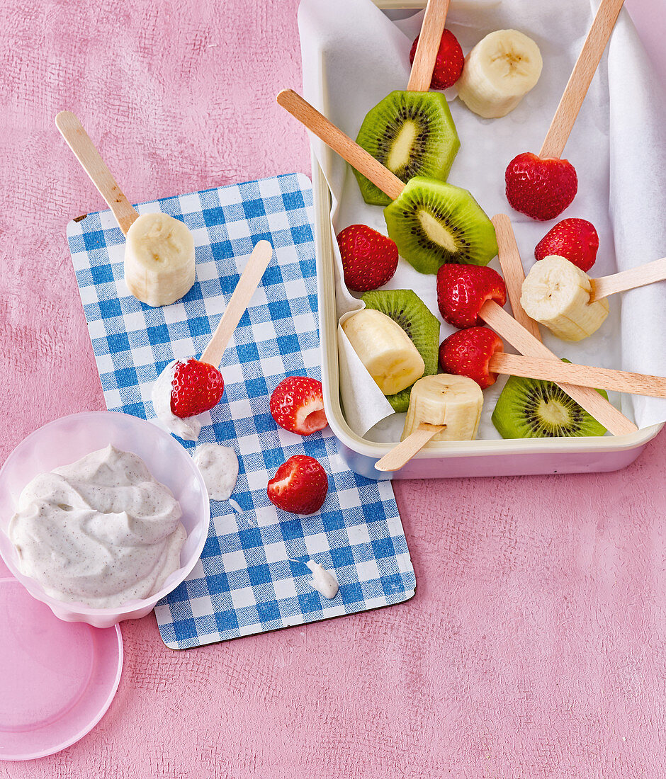 Fruit lollipops with yogurt dip
