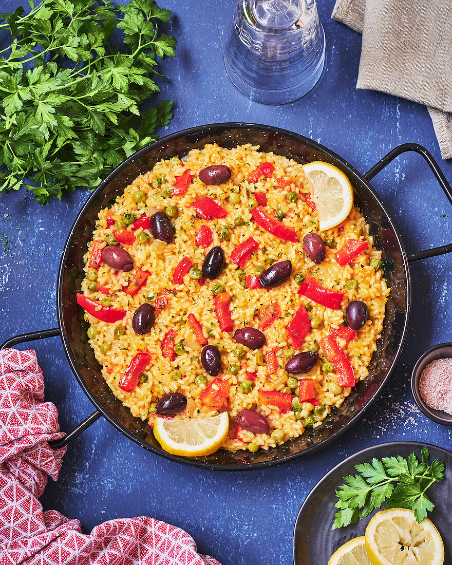 Spanish vegetable paella with peppers and olives
