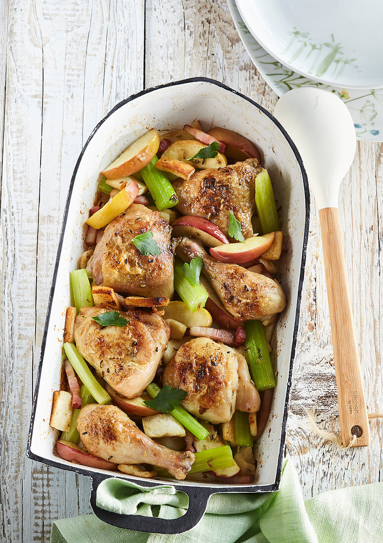Baked chicken with filling and sticks celery