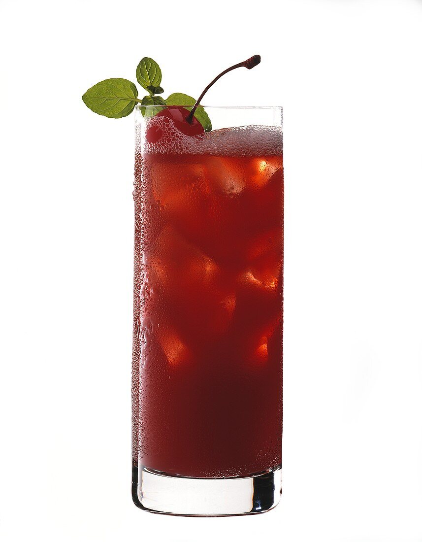 Zombie in tall glass garnished with cherry and mint
