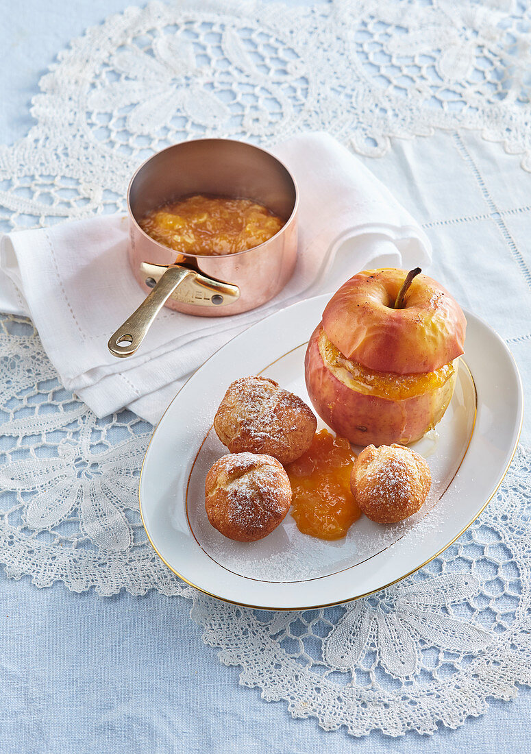 Baked apples with orange marmelade and doughnuts