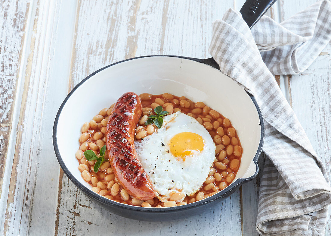 Beans with sausage and fried egg