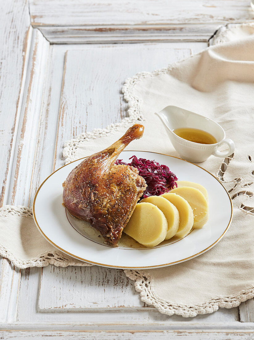 Honey duck with potato dumplings and red cabbage