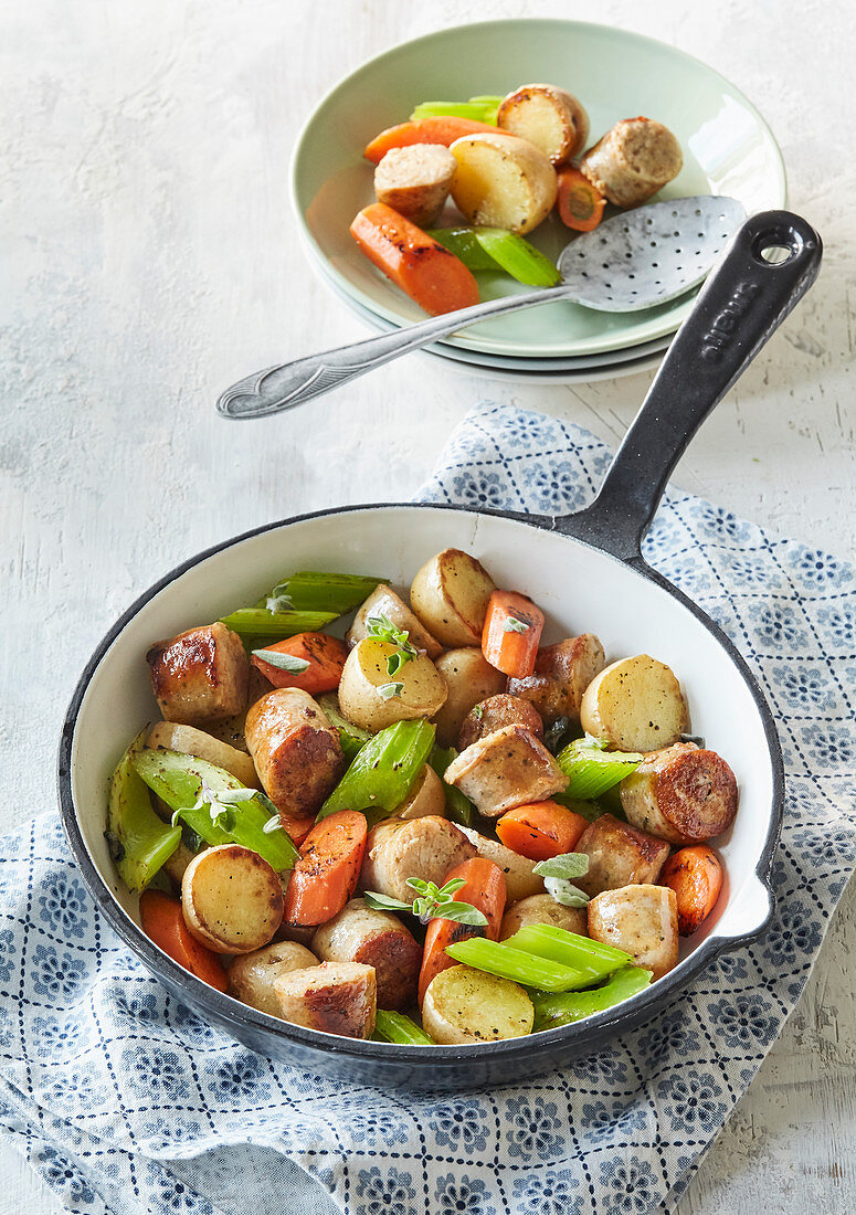 Fried sausages with new potatoes and vegetables