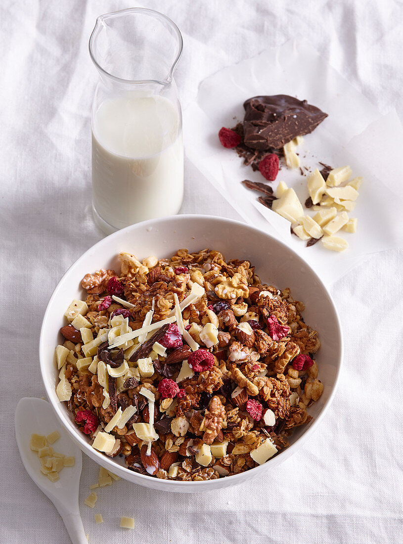 Home made granola with white and dark chocolate and berries