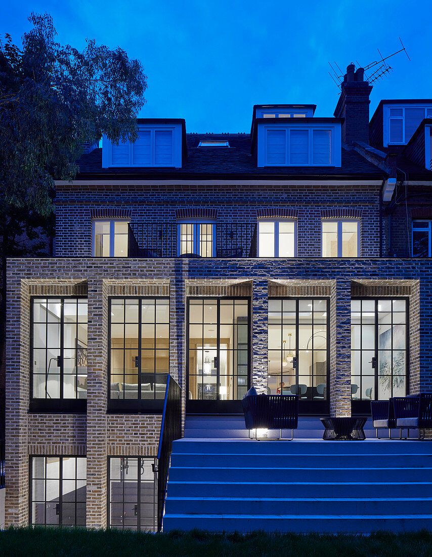 Classic brick house with lattice windows and terrace