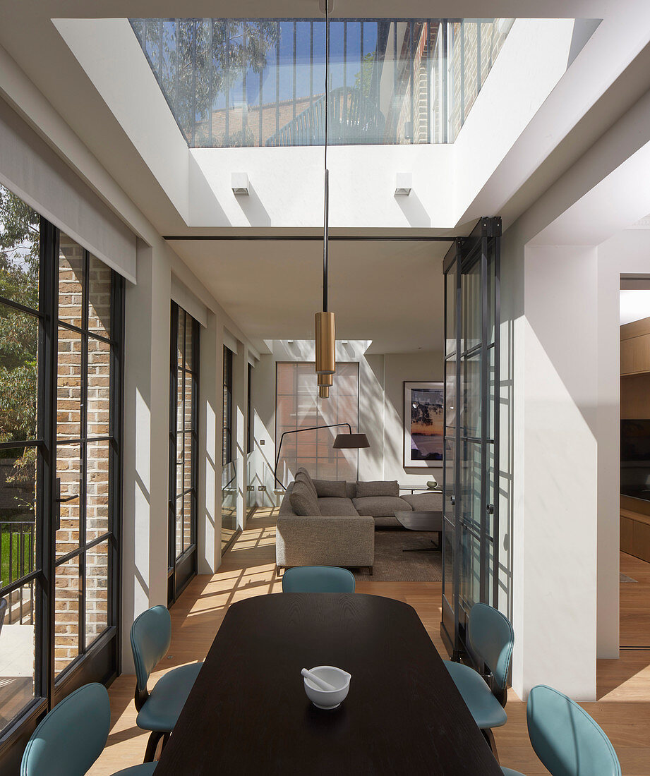 Modern, open-plan interior with skylights and lattice windows