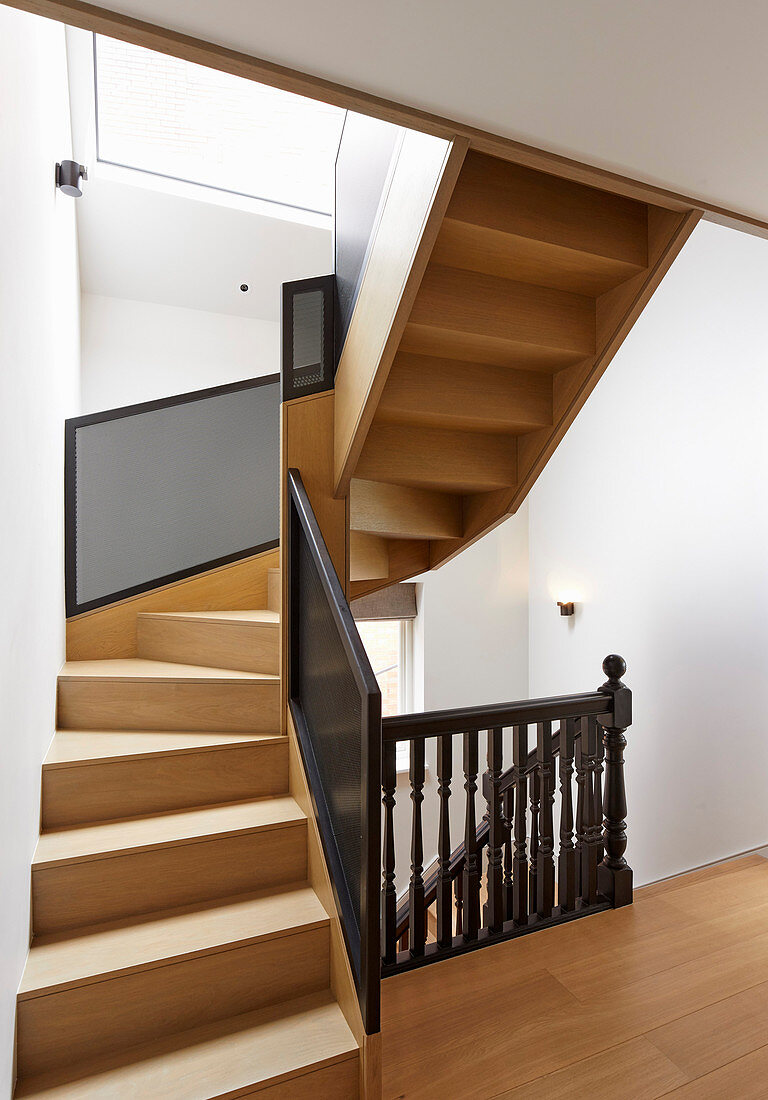 Staircase with old, turned banister spindles and modern balustrade