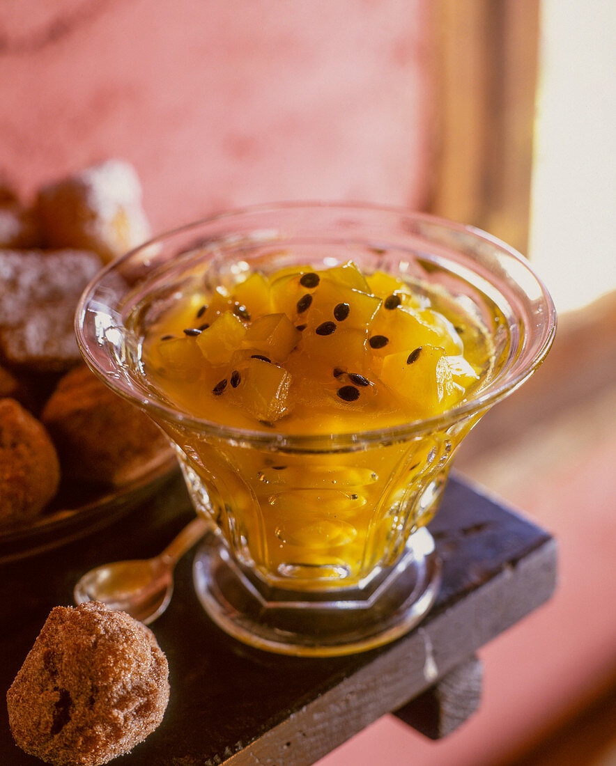 Mango and passion fruit preserve in a glass bowl