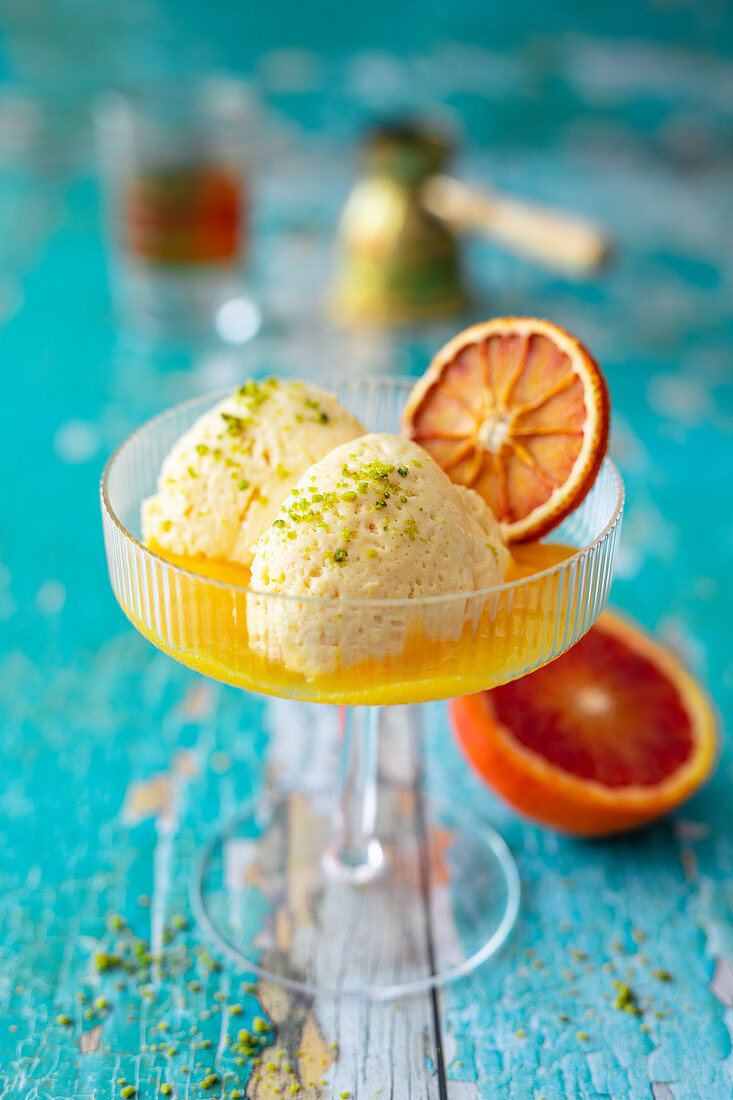 Blood orange mousse with oriental spices and pistachios