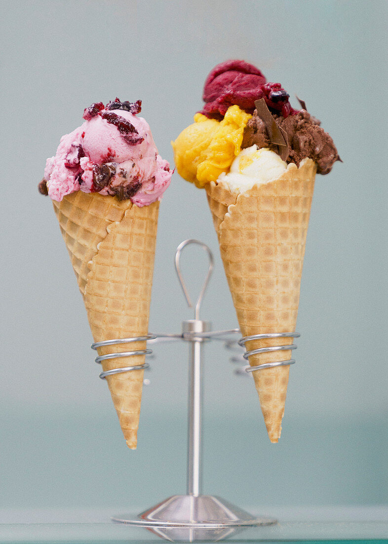 Ice cream and sherbet with toppings in waffle cones