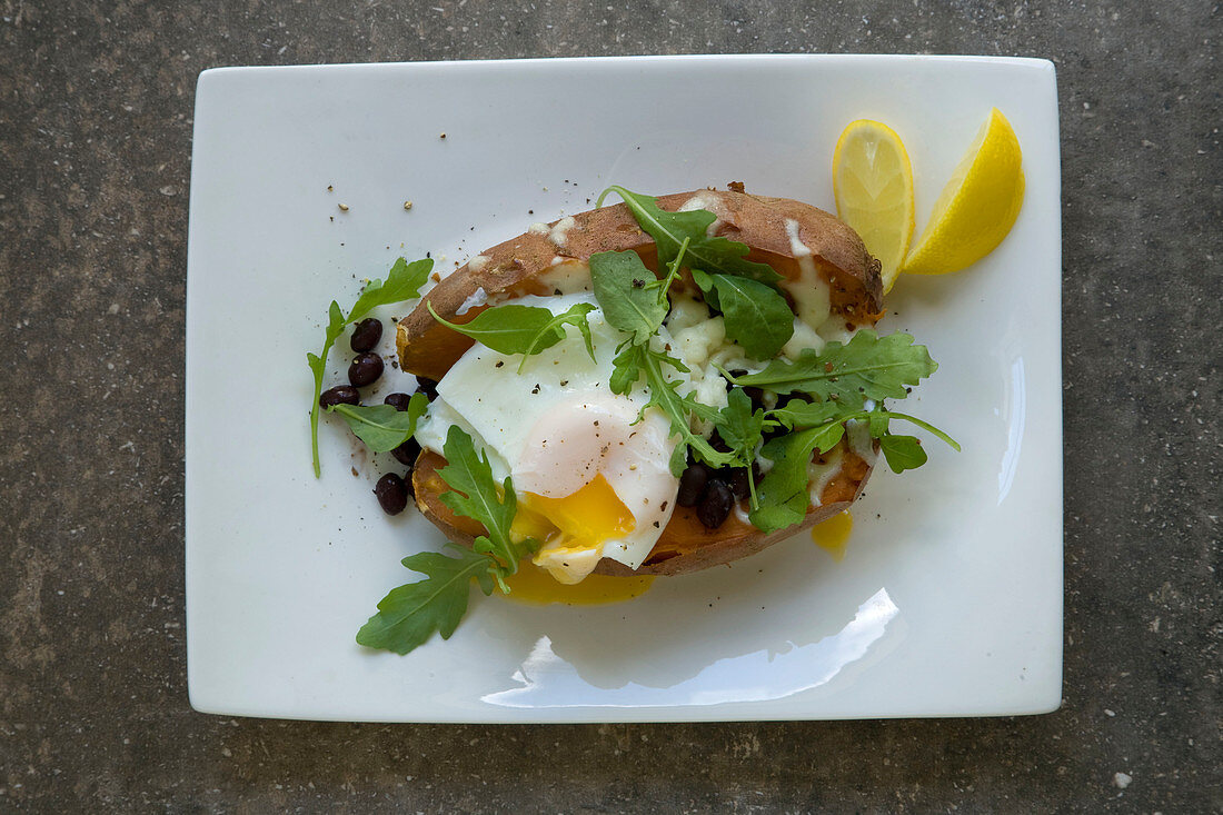 Oven sweet potato with black beans and poached eggs