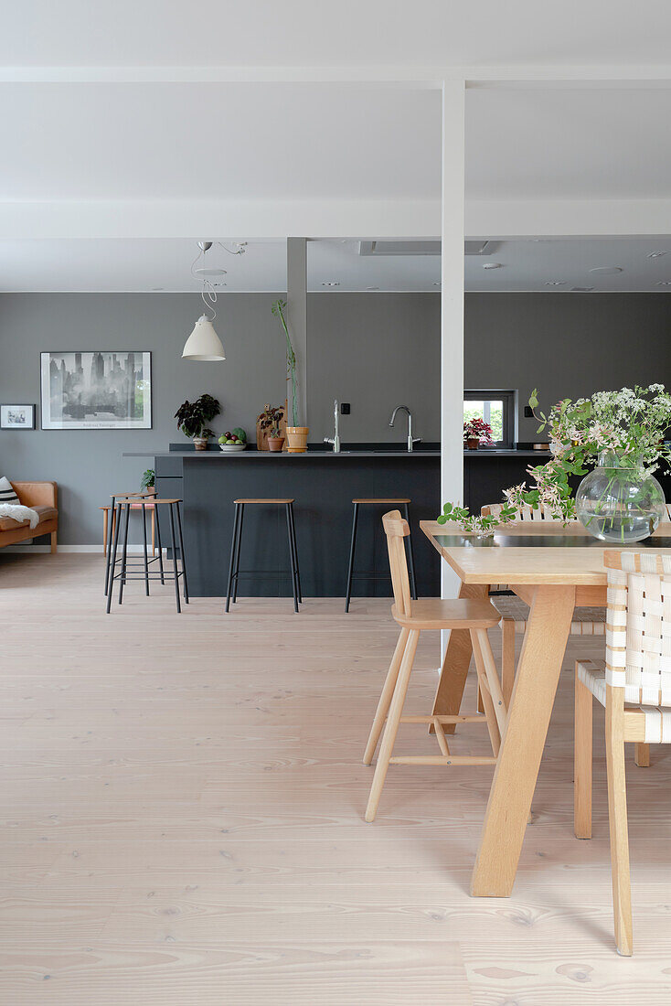 Open living room in Scandinavian style with grey walls