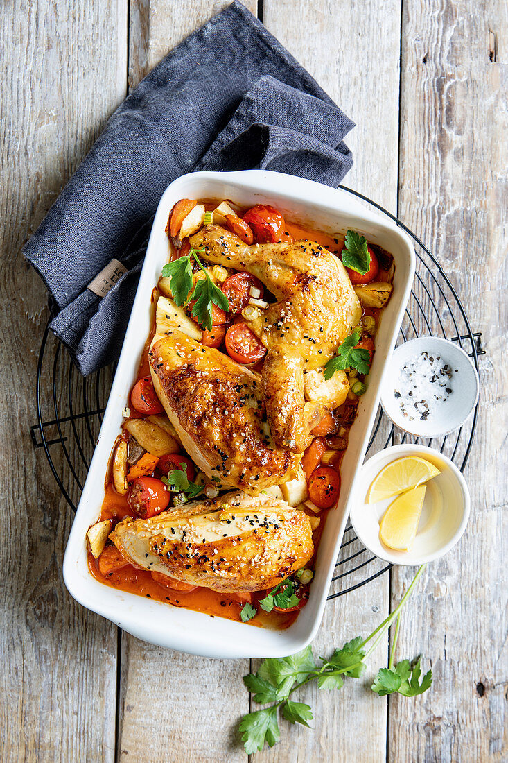Oven-roasted chicken with sesame seeds and vegetables