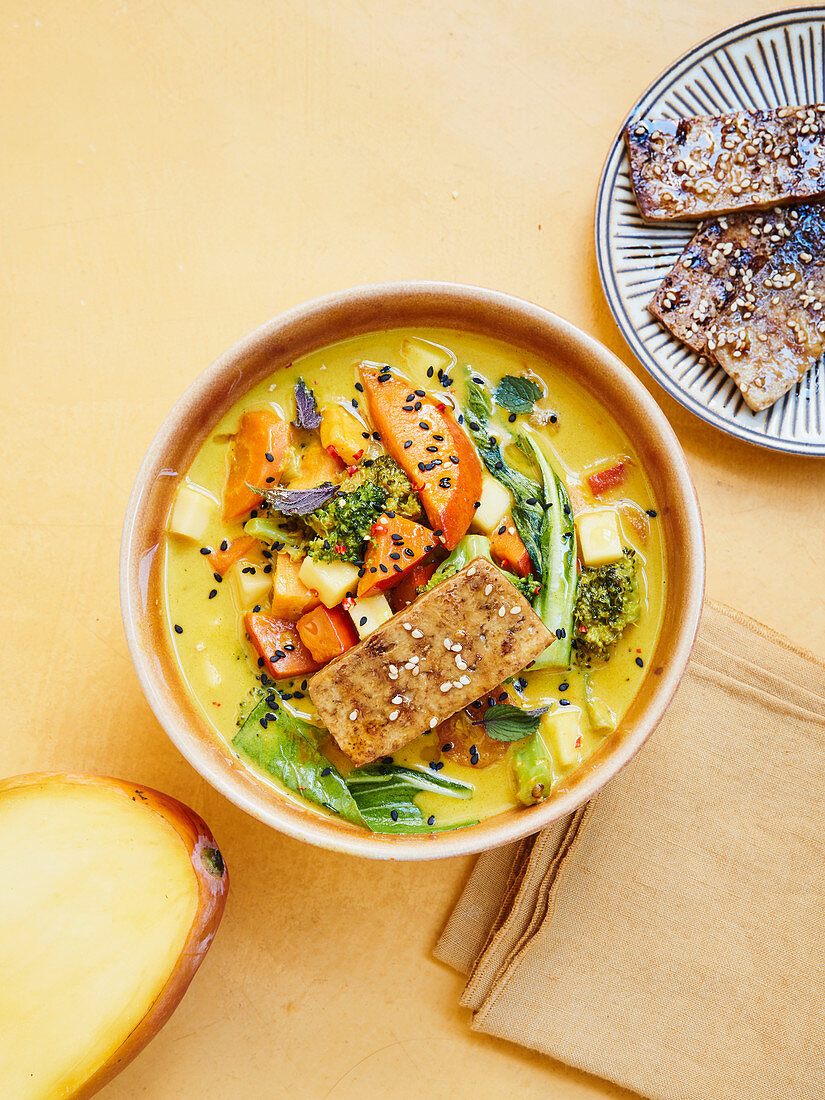 Spicy sweet potato curry with mango and crispy tofu