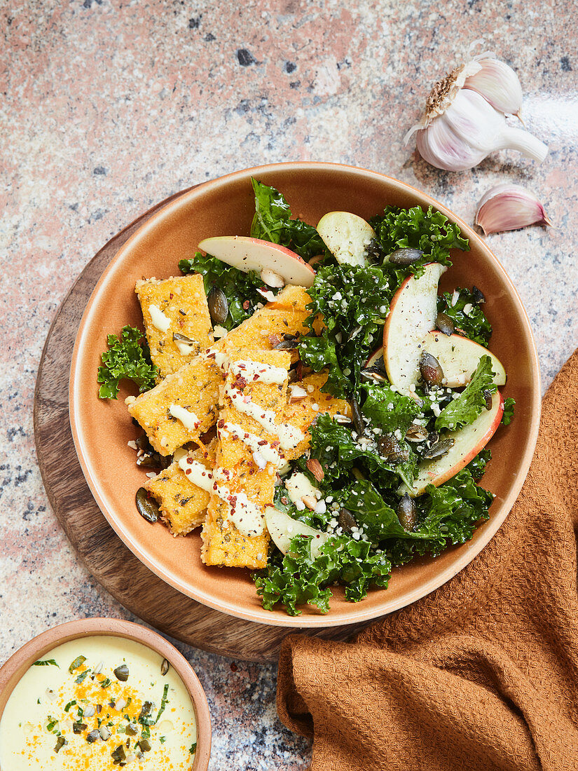 Polenta sticks with a kale and apple salad and turmeric aioli