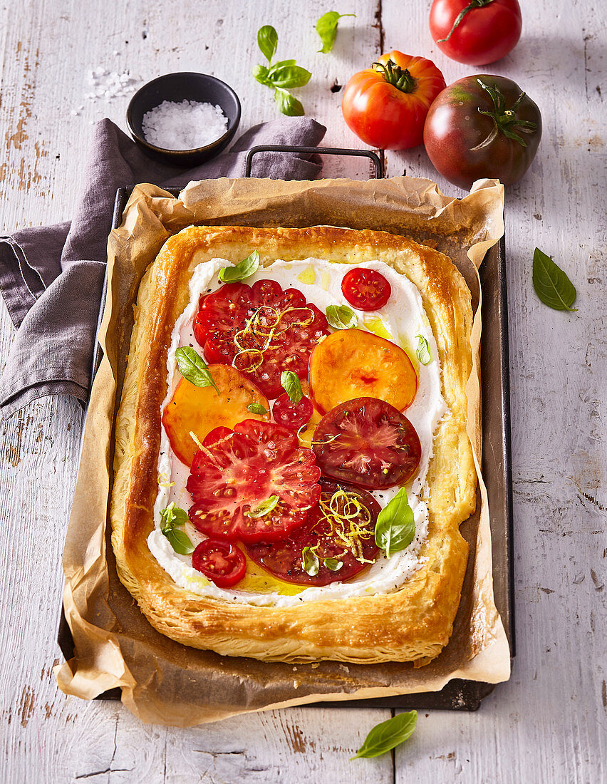 Puff pastry cake with ricotta and tomatoes