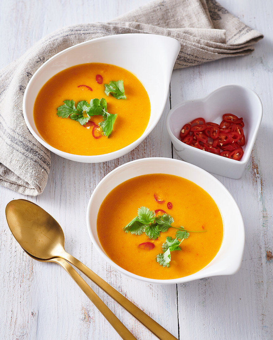 Pumpkin creamy soup with coconut milk and chili
