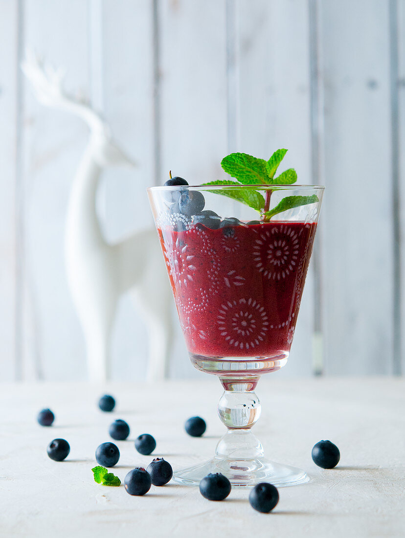 A blueberry smoothie with mint