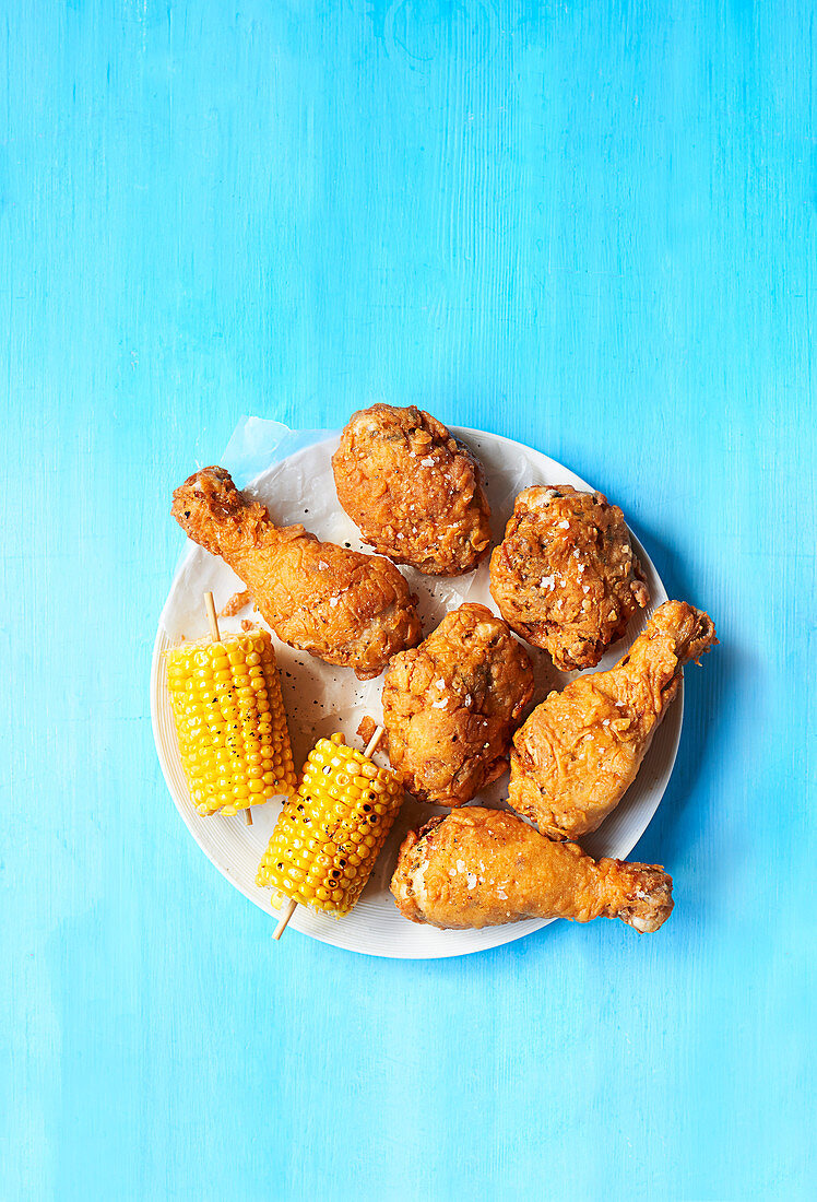 Crispy fried chicken and corn cob
