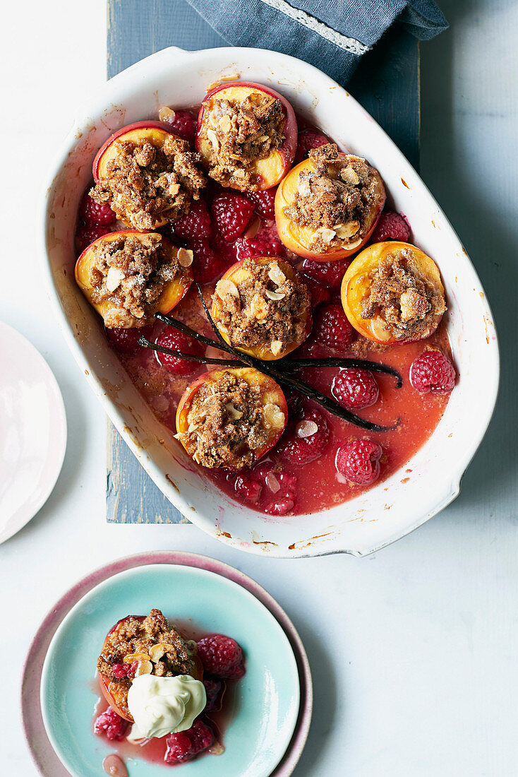Baked nectarines and raspberries with almond and honey