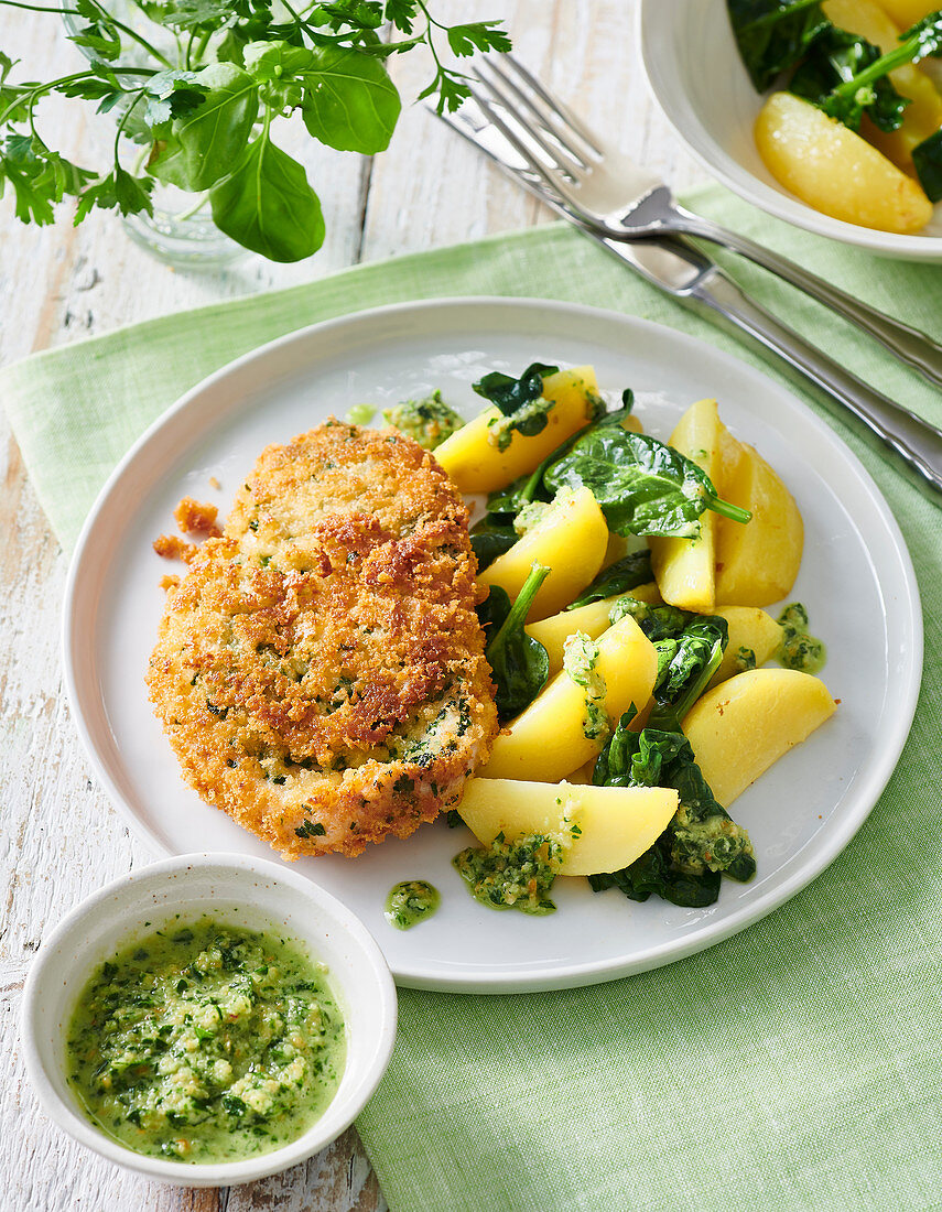 Turkey schnitzels with potatoes and chive-almond pesto