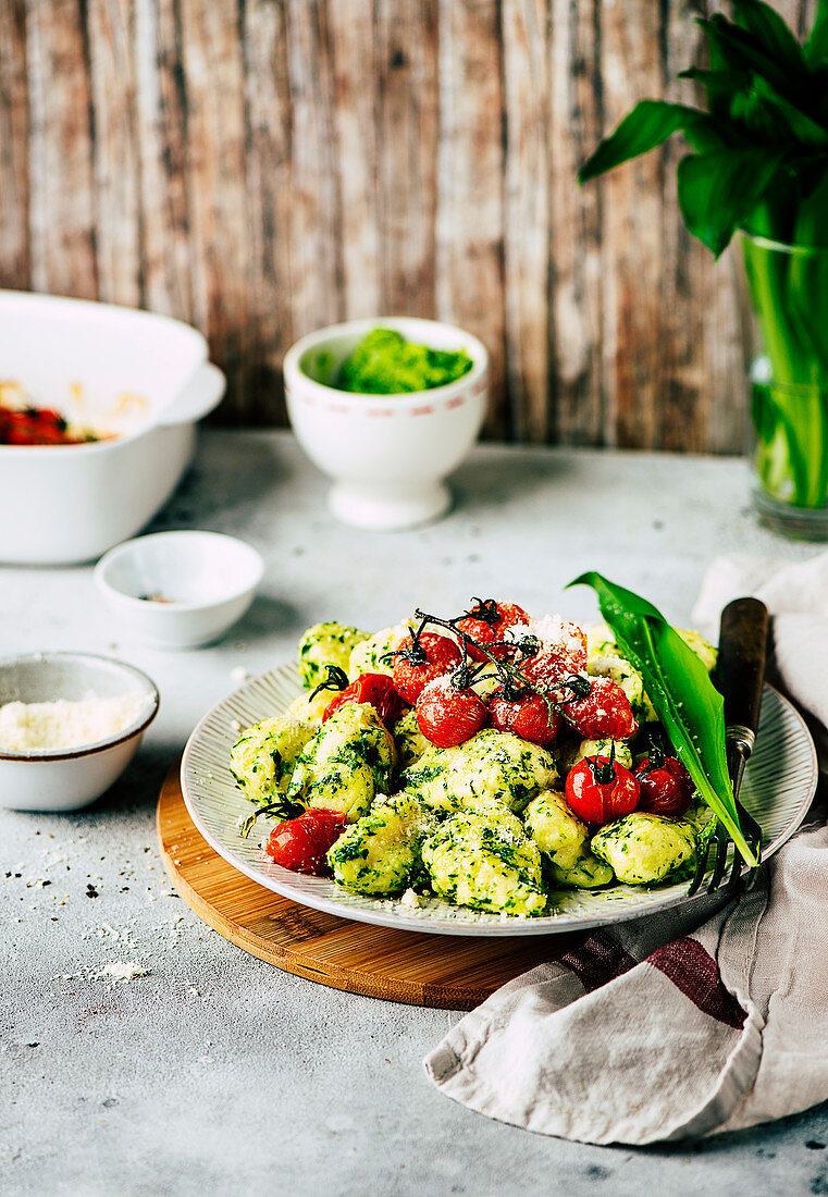 Delicate gnocchi in wild garlic butter with oven-roasted tomatoes