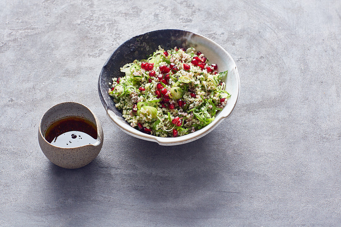 Tabbouleh with spring onions and pomegranate seeds