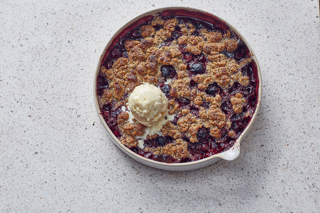 Sour cherry and poppyseed crumble with vanilla ice cream