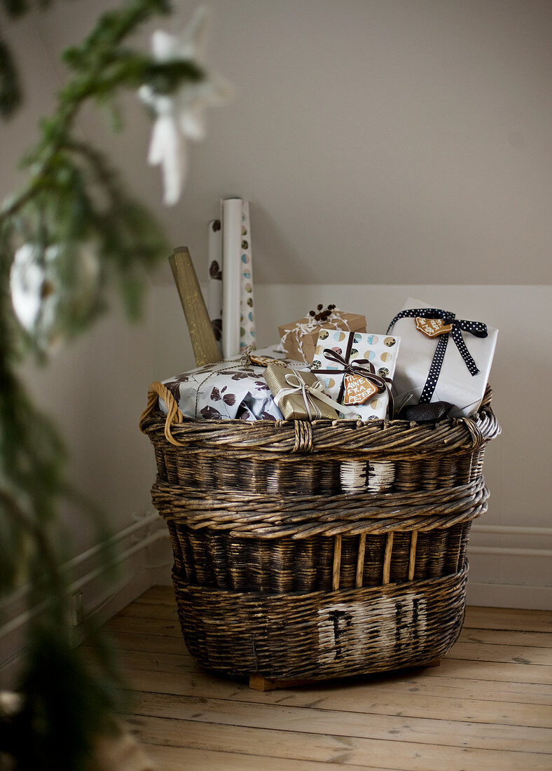 Wicker basket filled with Christmas presents