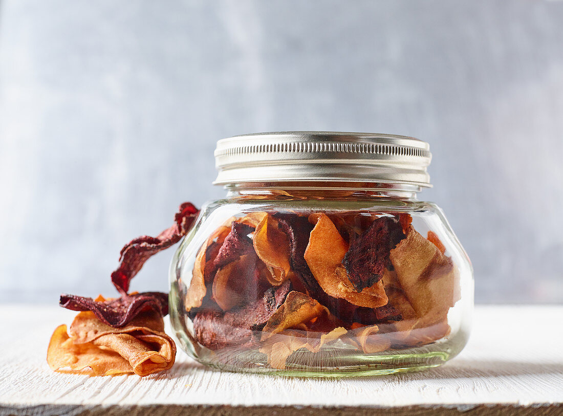 Colourful vegetables crisps in a screw-top jar