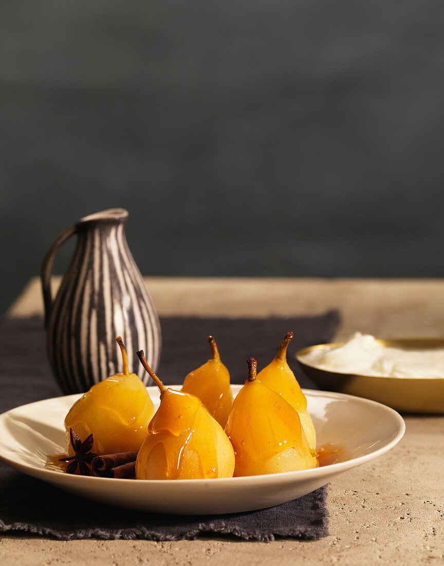 Glazed Poached Pears With Cinnamon Sticks