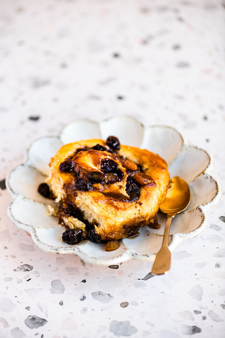 Sticky buns with raisins and a maple syrup glaze with sea salt flakes