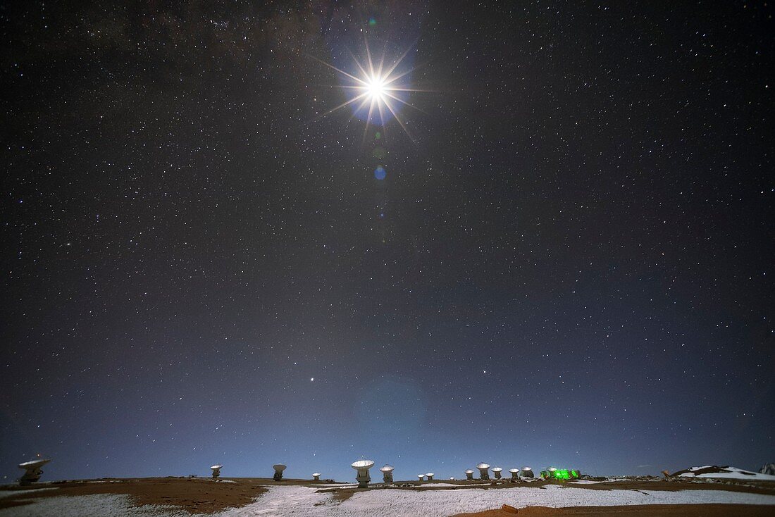 Moon shining over ALMA radio telescope, Chile
