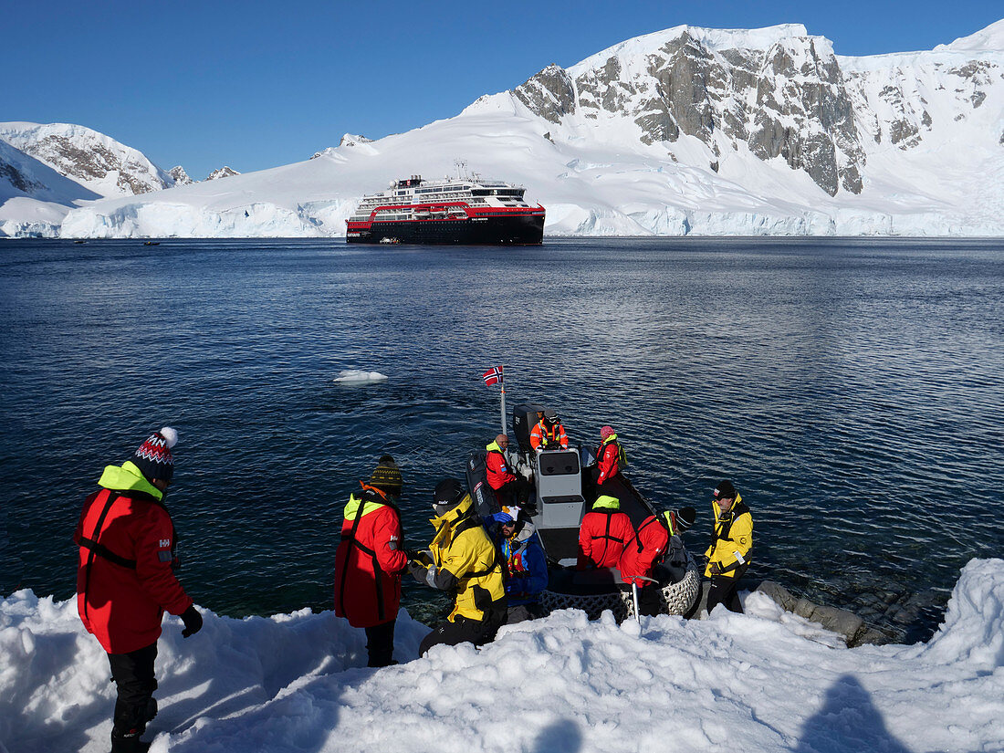 Landing party boarding zodiac in Orne Harbour, Antarctica