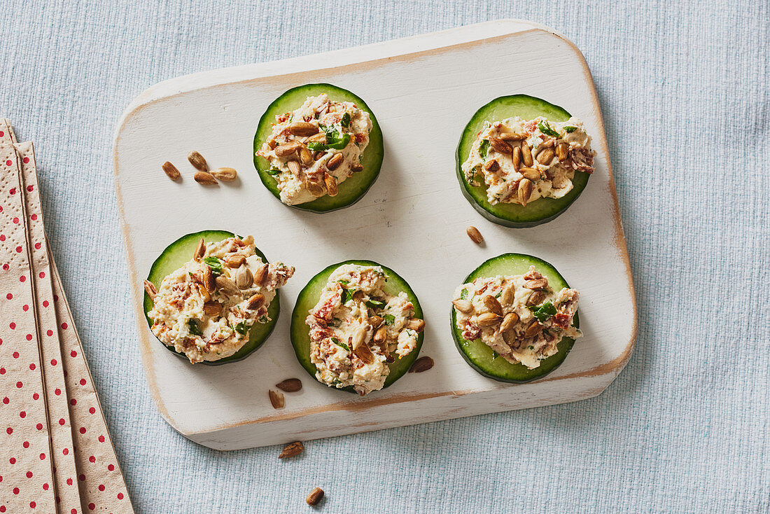 Cucumber canapés with cream cheese and dried tomatoes