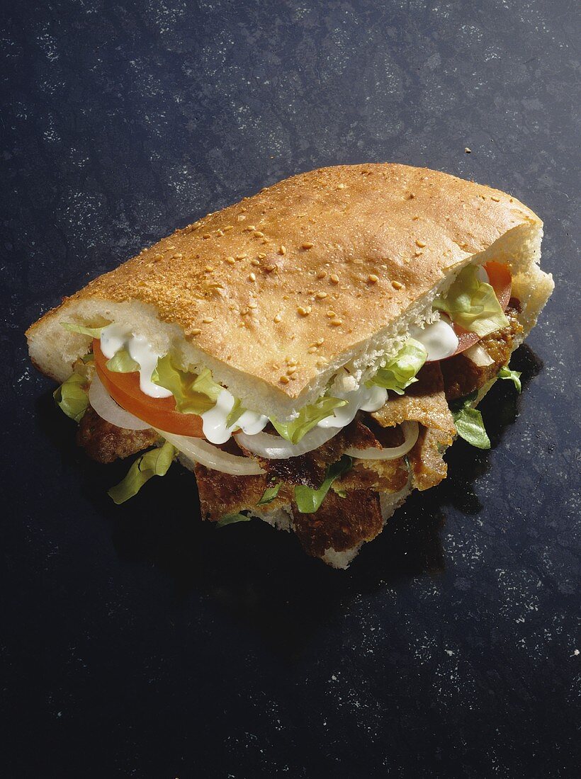 Gyros (Greek pita sandwiches) on dark background