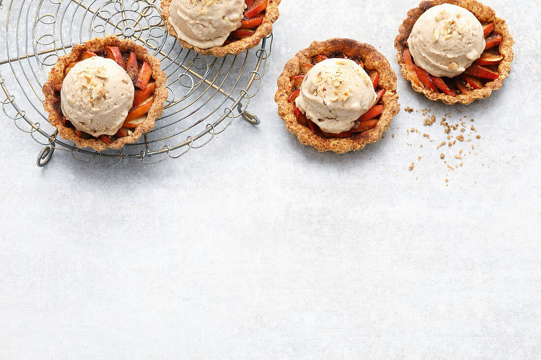 Vegan apple and cinnamon ice cream on apple and cinnamon tartlets