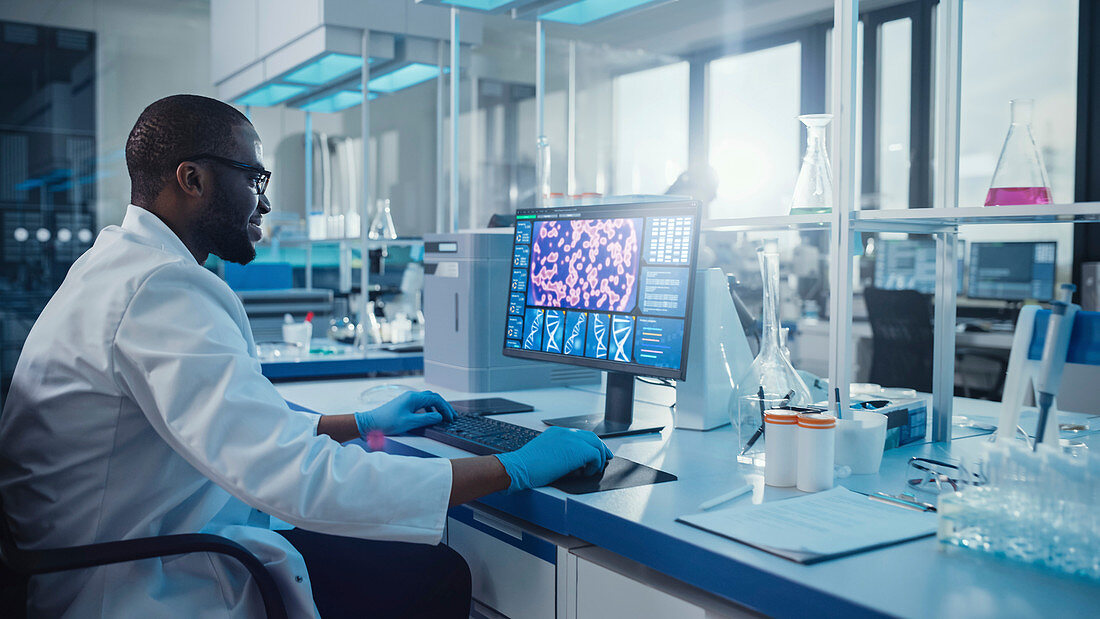 Scientist using a computer in a laboratory