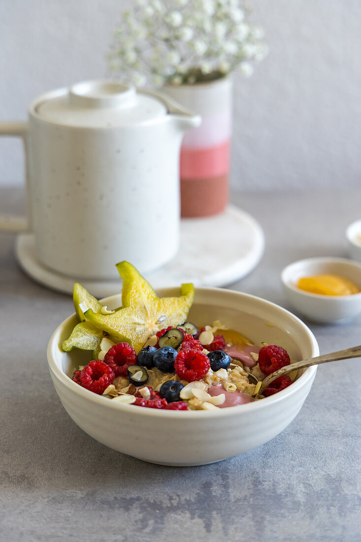 Oatmeal Breakfast Bowl with Fruits, Berries, Rubi Chocolate and Nuts