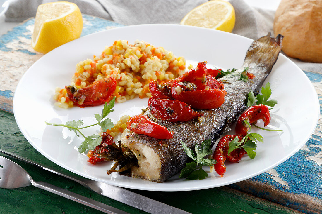 Baked trout with tomatoes and parsley