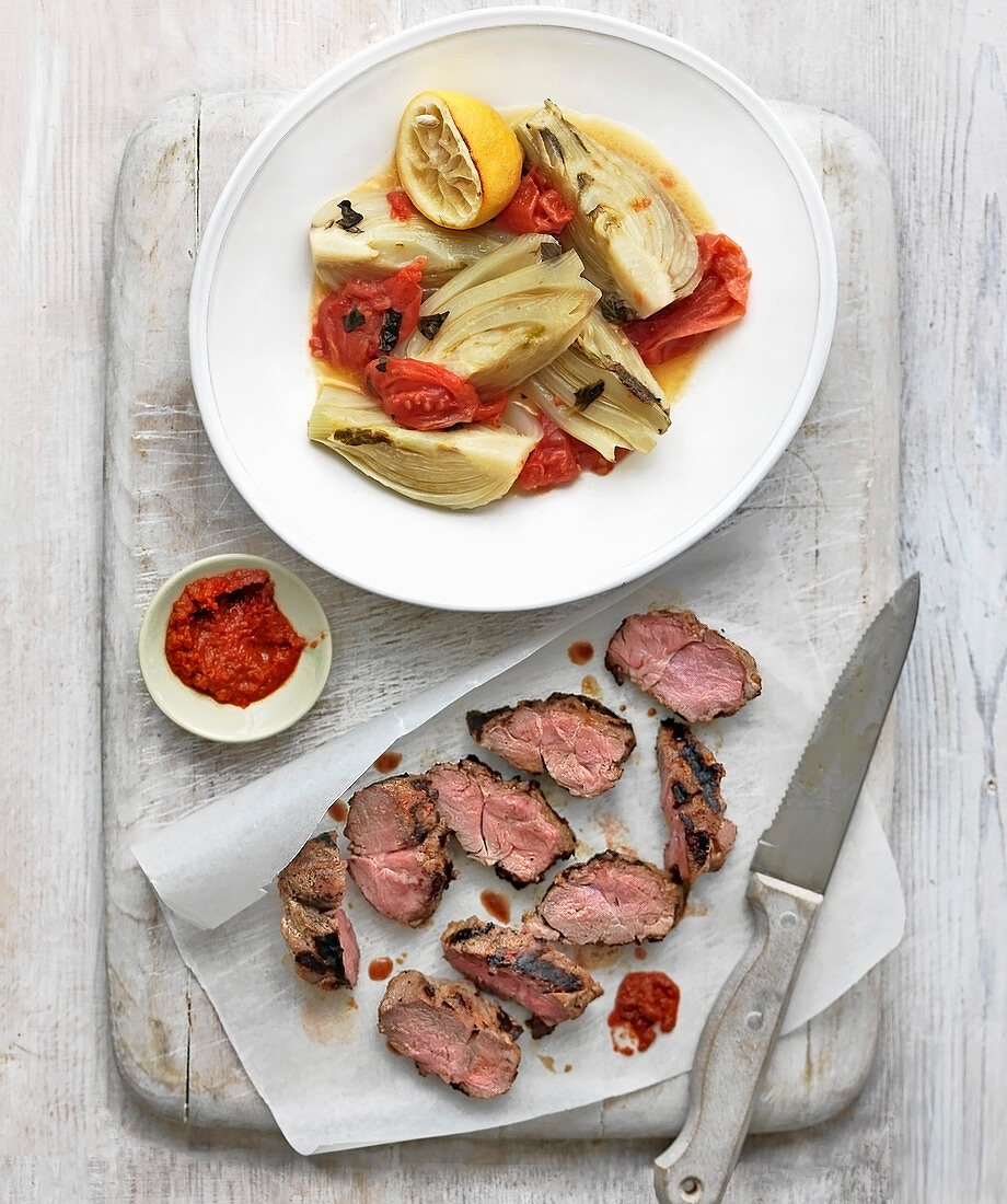 Harissa lamb with fennel tomato and herb parcels