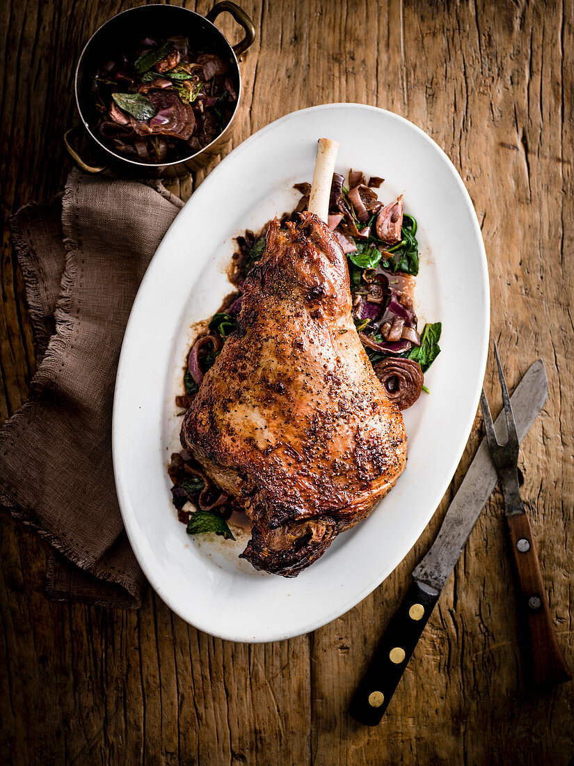 Leg of lamb with pomegranate and balsamic onions