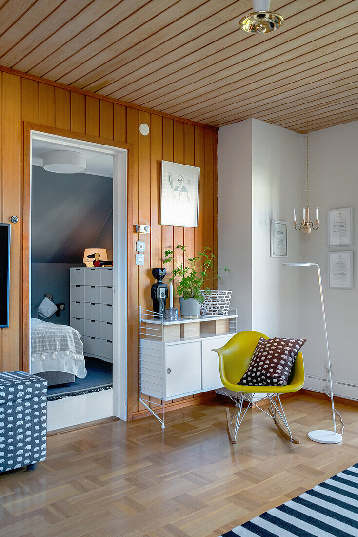 Classic rocking chair and floor lamp in the corner of room