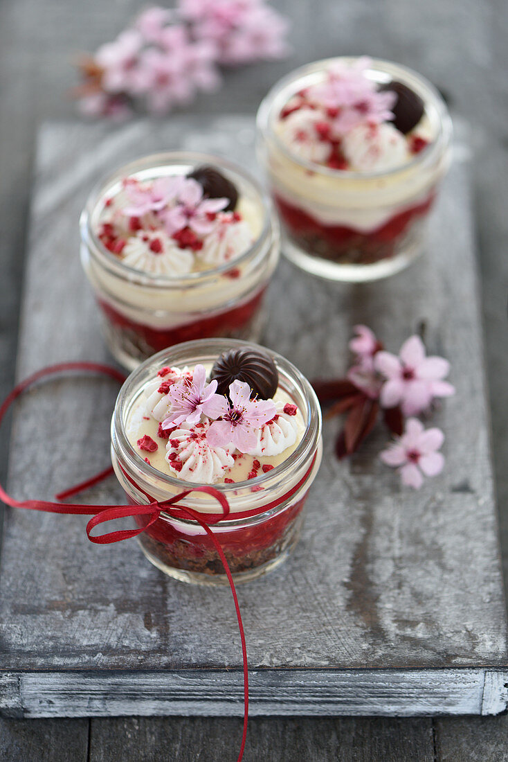 Vegan raspberry chocolate dessert in glasses, with chocolate biscuits