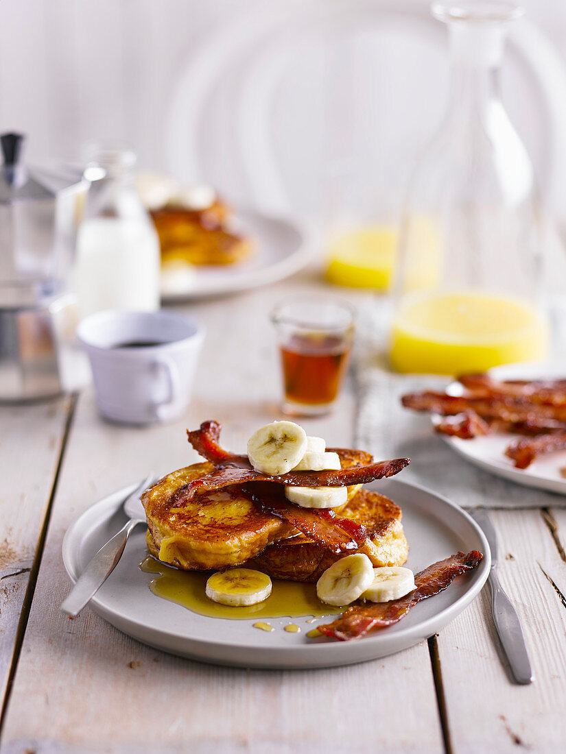 Brioche French toast with bacon, banana and maple syrup