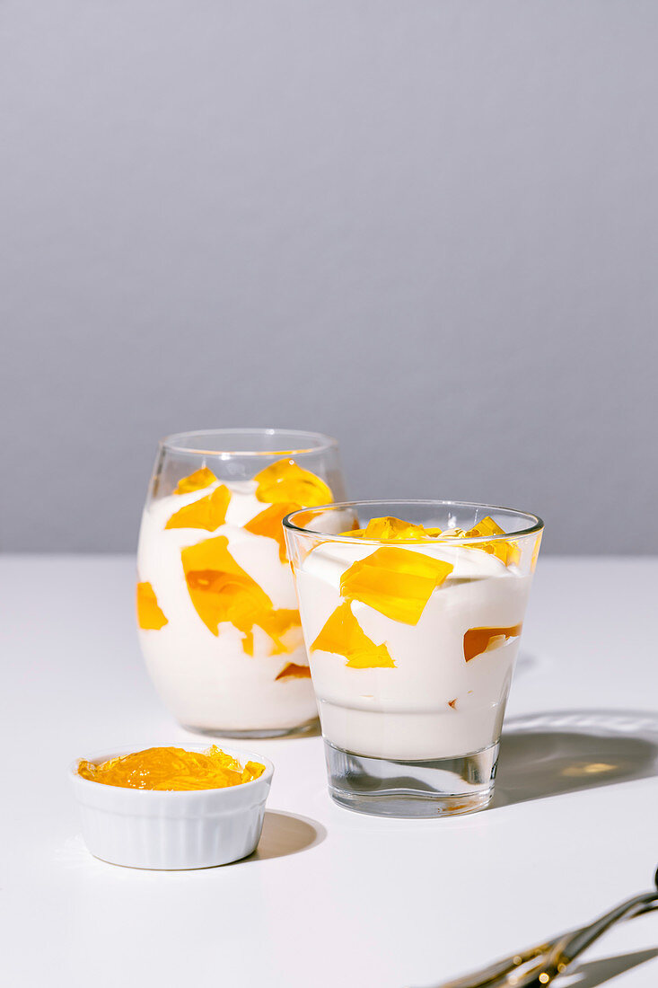Tangerine mosaic jelly dessert in glasses