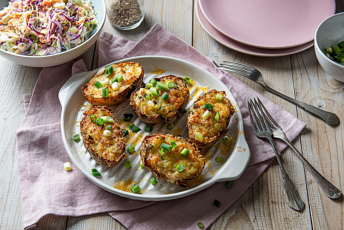 Loaded potato skins with cheese and spring onions